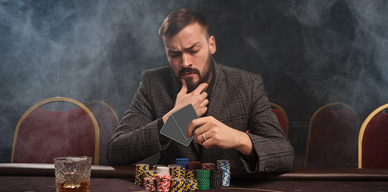 Concentrated casino player sitting at casino table